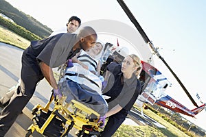 Paramedics Unloading Patient From Helicopter