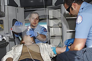 Paramedics With Victim In Ambulance photo