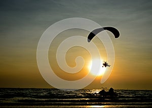 Paramotor flying over the sea