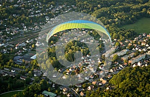 Paramotor flying over a village in France