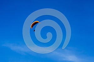 Paramotor flying on the sky.