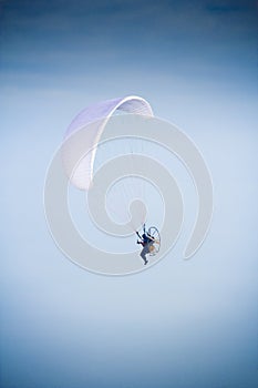 Paramotor glider flyes in the air