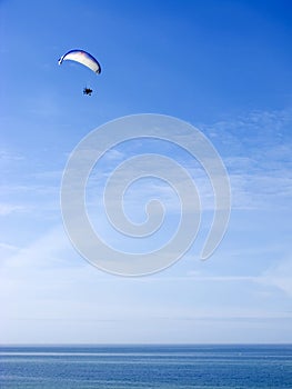 Paramotor glider over ocean