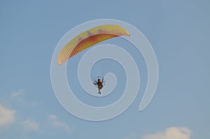 Paramotor overhead in the sky