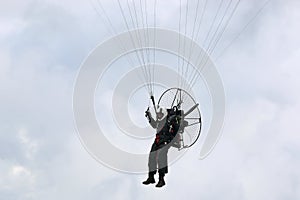Paramotor pilot coming in to land