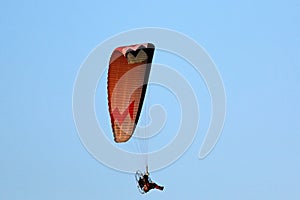 Paramotor pilot coming in to land