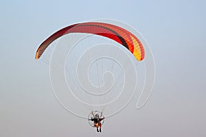 Paramotor pilot coming in to land