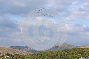 Paramotor pilot in the hills of Wales