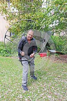 Paramotor pilot preparing his engine