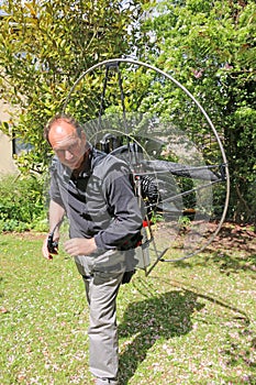 Paramotor pilot preparing his engine