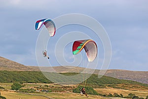 Paramotor pilots flying in to land