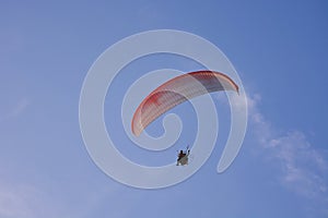 Paramotor Powered Paraglider With Red-White Parachute Flying In Sky, Extreme Sport