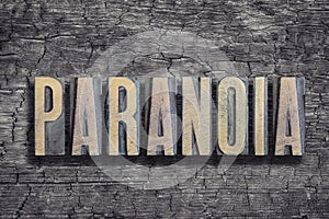 Paranoia word burned wood photo