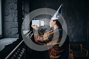 Paranoid man in tinfoil cap, mind protection, UFO