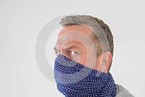Paranoid man wearing a face guard against Covid-19