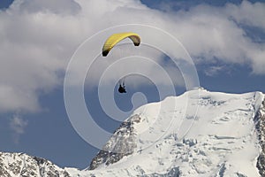 Parapenter above over french snowy Mont Blanc massif