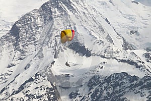 Parapenter over french snowy Mont Blanc massif