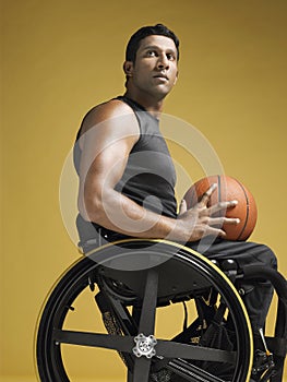 Paraplegic Athlete With Basketball In Wheelchair