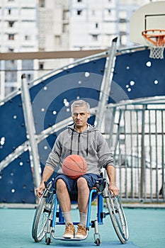 Paraplegic sportsman playing basketball