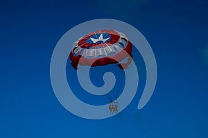 Parasailing in a blue sky in Cancun, Mexico