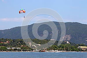 Parasailing on blue sky Corfu island