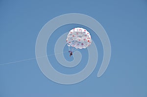 Parasailing in the blue sky whith parachute