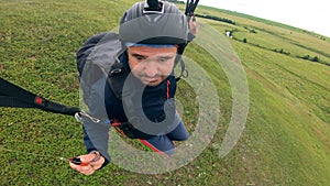 Parasailing held by the man with the parafoil