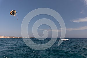 Parasailing. the man is flying with a yellow parachute. close-up.