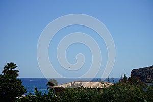 Parasailing in the Mediterranean. Parasailing is a recreational kiting activity where a person is towed behind a vehicle. Rhodes