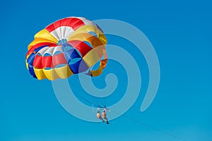 Parasailing, skydiving high in the blue sky