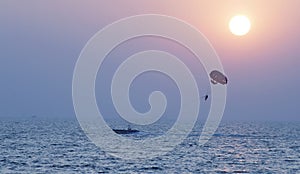 Parasailing at sunset