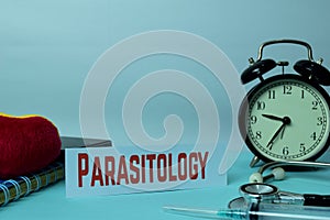 Parasitology Planning on Background of Working Table with Office Supplies. Medical and Healthcare Concept Planning on White