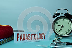 Parasitology Planning on Background of Working Table with Office Supplies. Medical and Healthcare Concept Planning on White photo