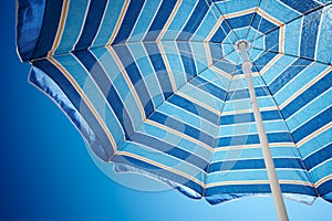 Parasol against deep blue sky