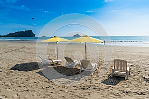 Parasol with chairs at Playa Espadilla at Manuel Antonio Park - Costa Rica photo