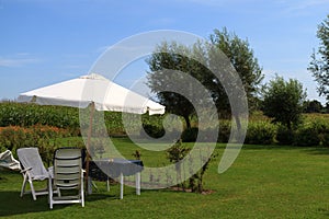 Parasol and furniture garden