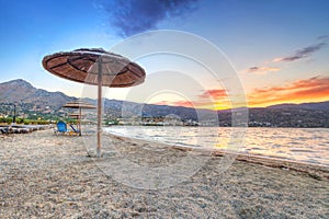 Parasol at Mirabello Bay at sunset