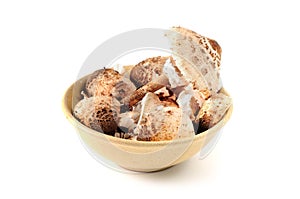 Parasol mushrooms in a bowl at white isolated background