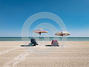 Parasol sub umbrella at the lonely beach and sea side