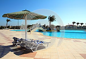 Parasol and swimming pool in hotel