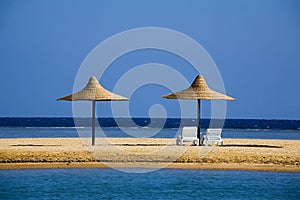 Parasols on a beach in the morning