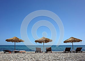 parasols on beach on Samos island, Greece