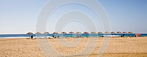 Parasols on beach, Sardinia