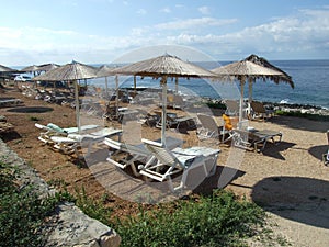 Parasols and deck-chairs on the Porto Roxa beach