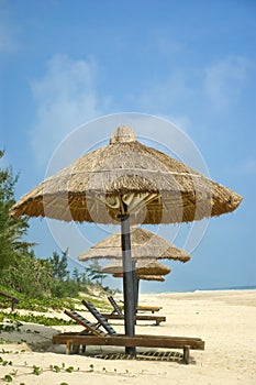 Parasols on idyllic beach