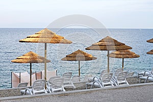Parasols and sun loungers photo