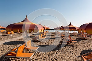 Parasols and sunbeds in Torre Pedrera near Rimini in Italy photo