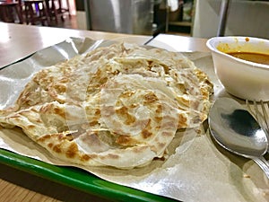 Paratha, an indian bread with curry