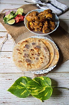 Paratha meaning an Indian style of bread made with flour