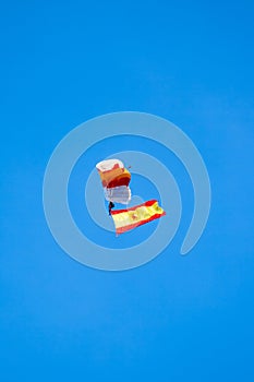Paratrooper with the flag of Spain in flight